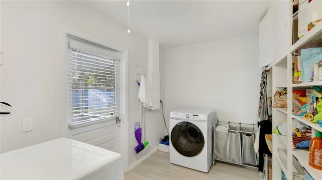 a view of a storage & utility room with washer and dryer