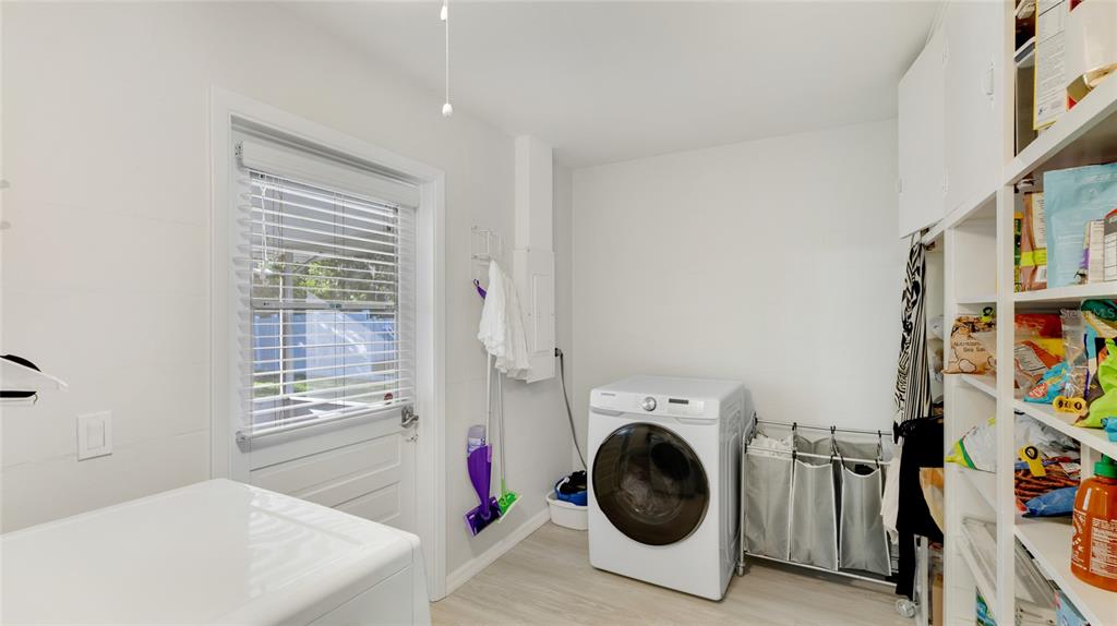 6726 South Lockwood Ridge Road Sarasota, FL 34231 - Photo 28 of 36 a view of a storage & utility room with washer and dryer