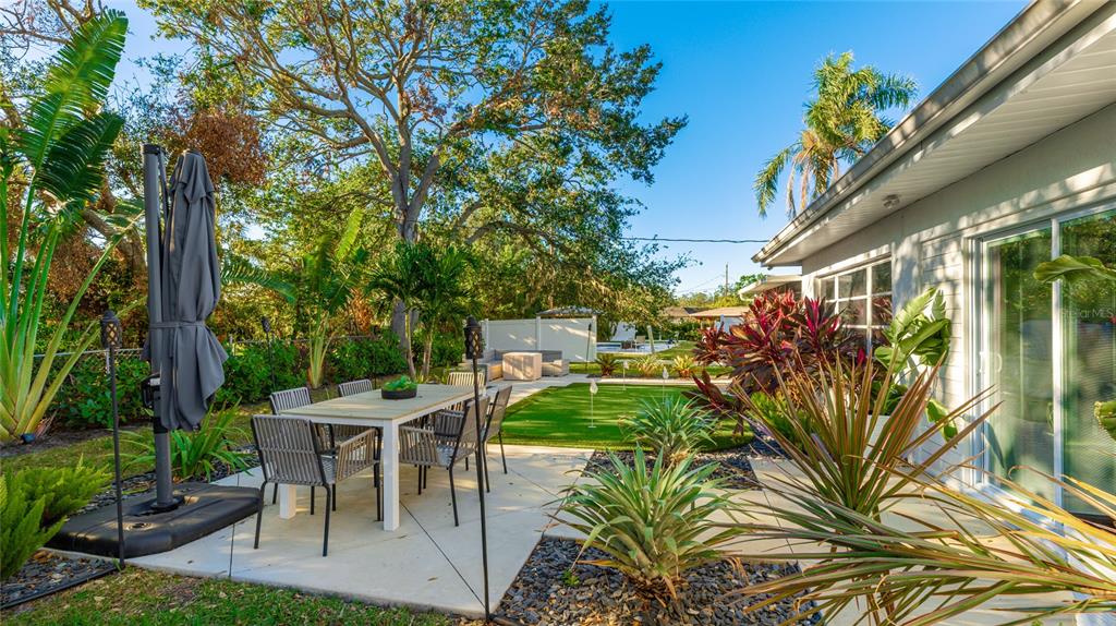 6726 South Lockwood Ridge Road Sarasota, FL 34231 - Photo 33 of 36 a view of outdoor dining space with a patio
