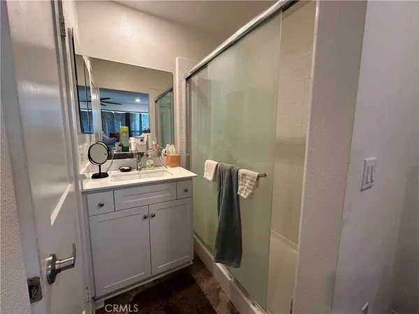 a bathroom with a double vanity sink and mirror