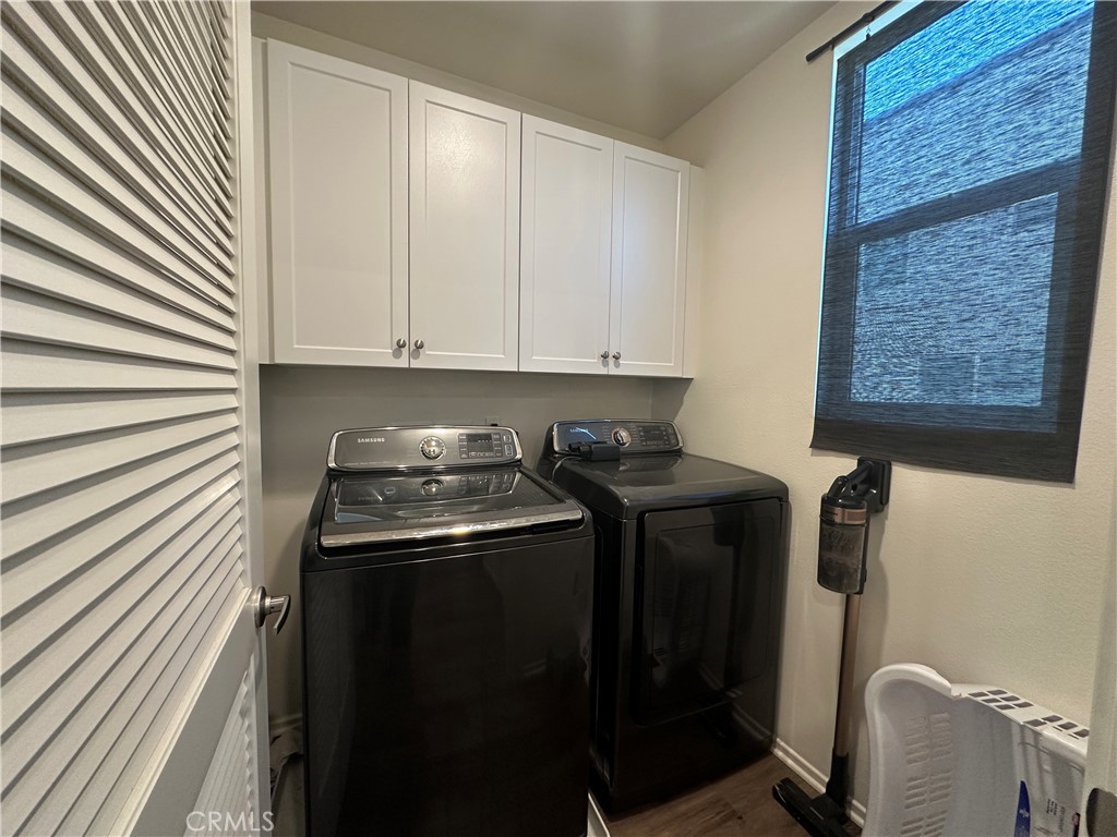 17612 Garden House Lane Bellflower, CA 90706 - Photo 16 of 31 a kitchen with a stove and a cabinet