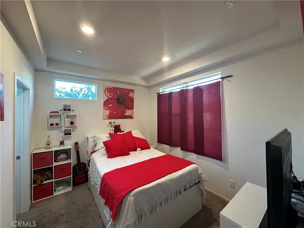 a bedroom with a bed and a closet