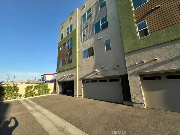 a front view of a building with a garage