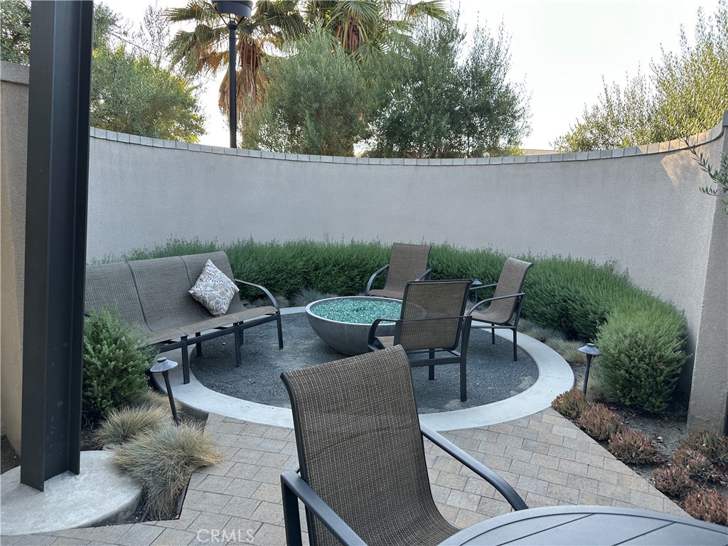 17612 Garden House Lane Bellflower, CA 90706 - Photo 25 of 31 an outdoor sitting area with furniture and wooden fence
