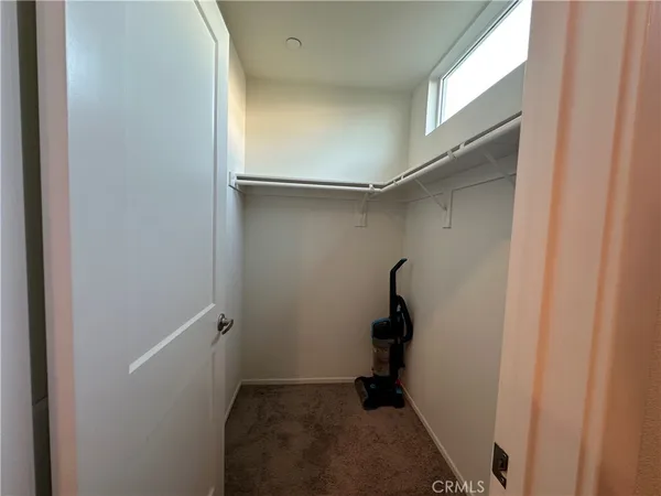 a bathroom with a sink double vanity and a toilet