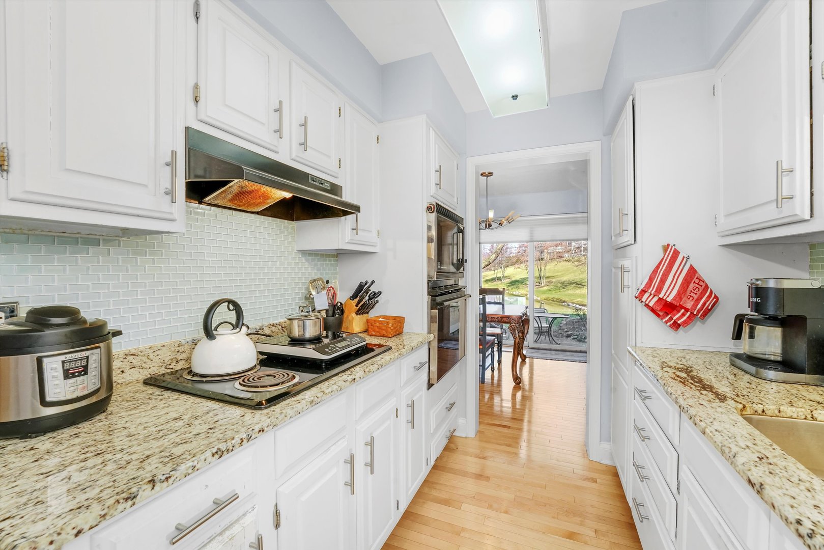 14501 Golf Road Orland Park, IL 60462 - Photo 15 of 53 a kitchen with stove and cabinets