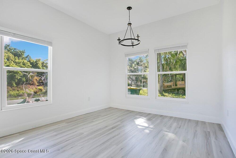 2498 Mitchell Avenue Mims, FL 32754 - Photo 11 of 31 a view of an empty room with windows