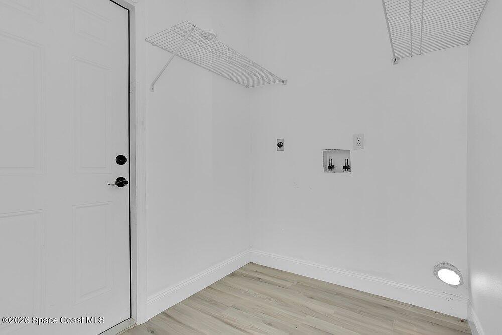 2498 Mitchell Avenue Mims, FL 32754 - Photo 12 of 31 a view of small space with wooden floor