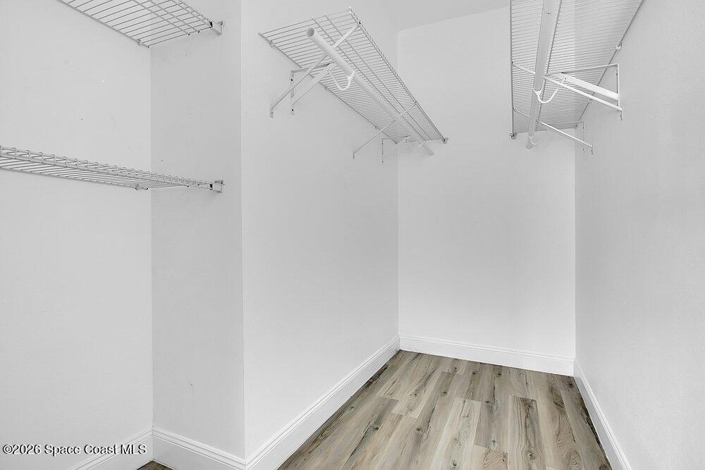 2498 Mitchell Avenue Mims, FL 32754 - Photo 16 of 31 a view of walk in closet with empty racks