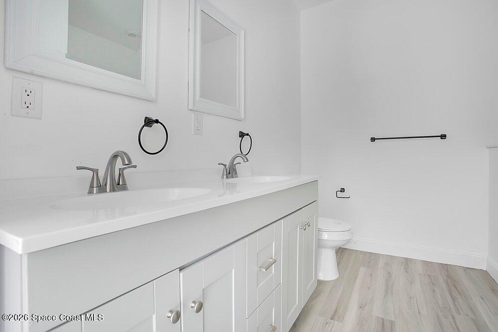 2498 Mitchell Avenue Mims, FL 32754 - Photo 19 of 31 a bathroom with a sink and a toilet