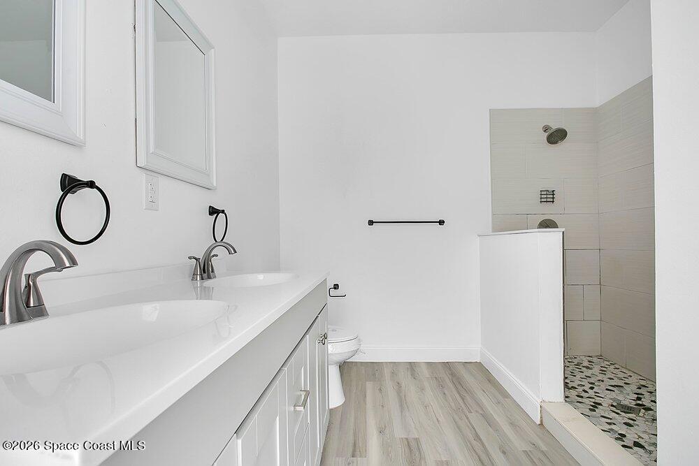 2498 Mitchell Avenue Mims, FL 32754 - Photo 20 of 31 a bathroom with a sink and a mirror