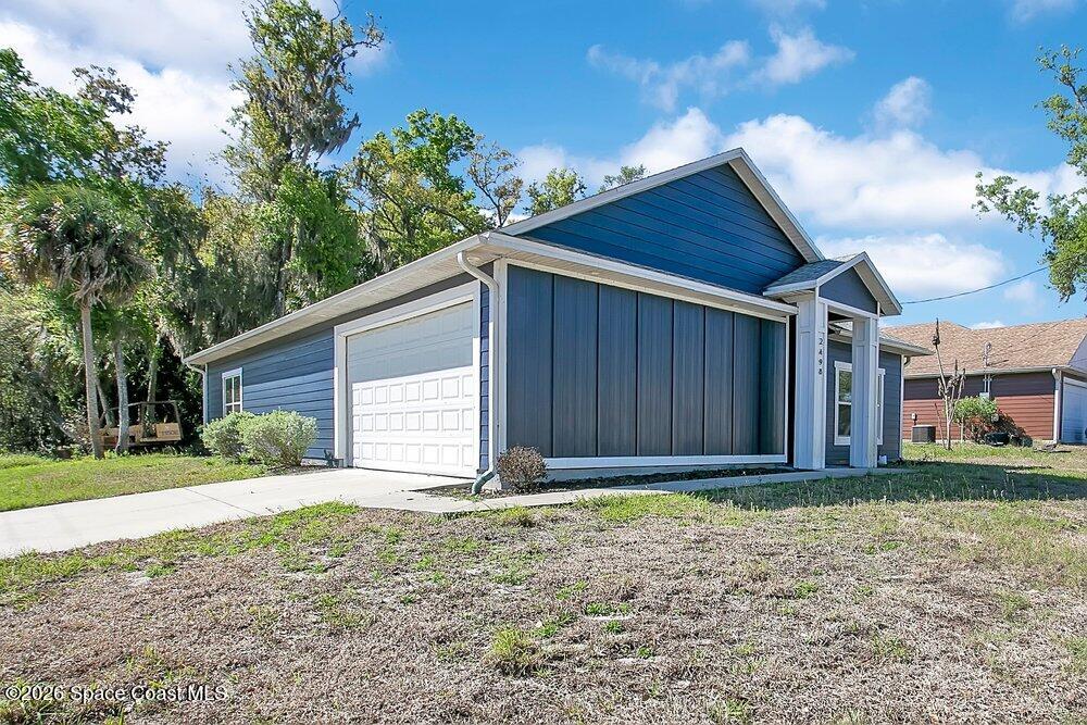 2498 Mitchell Avenue Mims, FL 32754 - Photo 2 of 31 a view of a backyard
