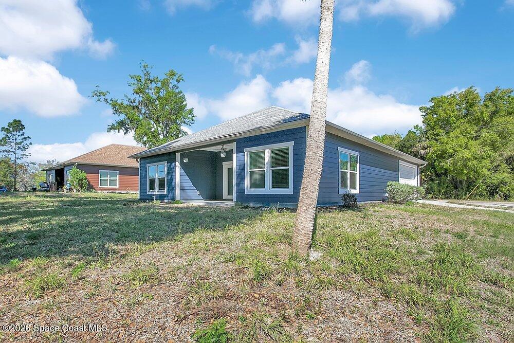 2498 Mitchell Avenue Mims, FL 32754 - Photo 22 of 31 a view of a house with a yard