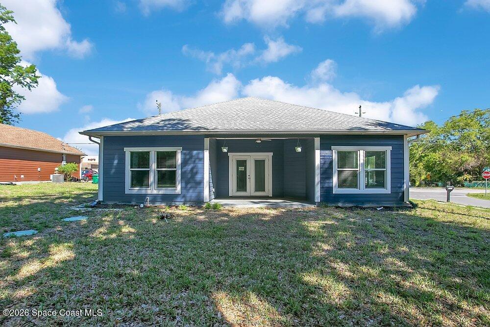 2498 Mitchell Avenue Mims, FL 32754 - Photo 23 of 31 a front view of a house with a garden