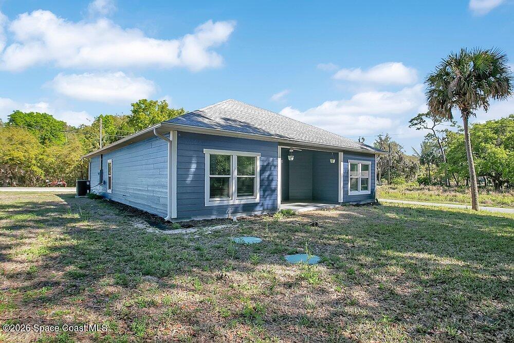 2498 Mitchell Avenue Mims, FL 32754 - Photo 24 of 31 a front view of a house with garden