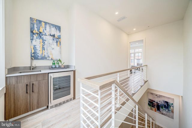 a spacious bathroom with a double vanity sink and a mirror