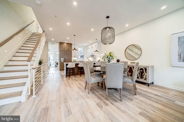 a living room with lots of furniture and a clock