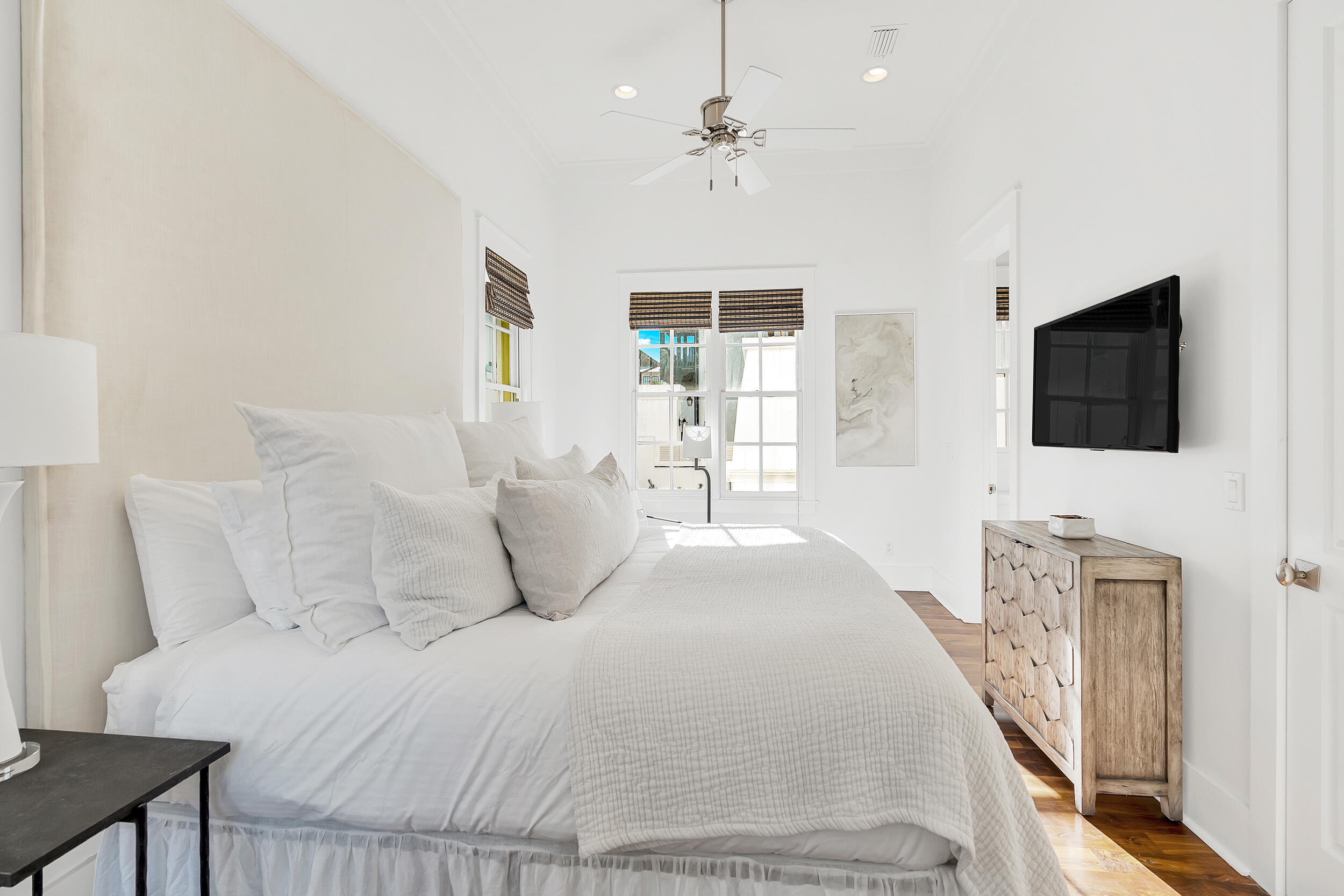 132 Kingston Road Rosemary Beach, FL 32461 - Photo 20 of 70 a bedroom with a large bed a flat tv screen and a dresser