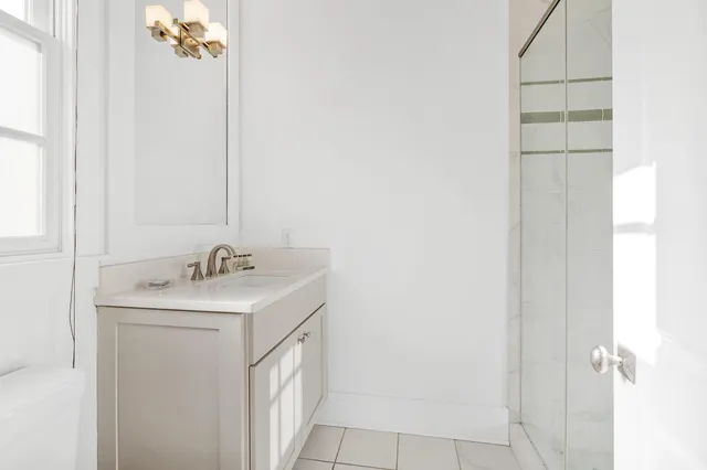 a kitchen with stainless steel appliances a refrigerator sink and cabinets
