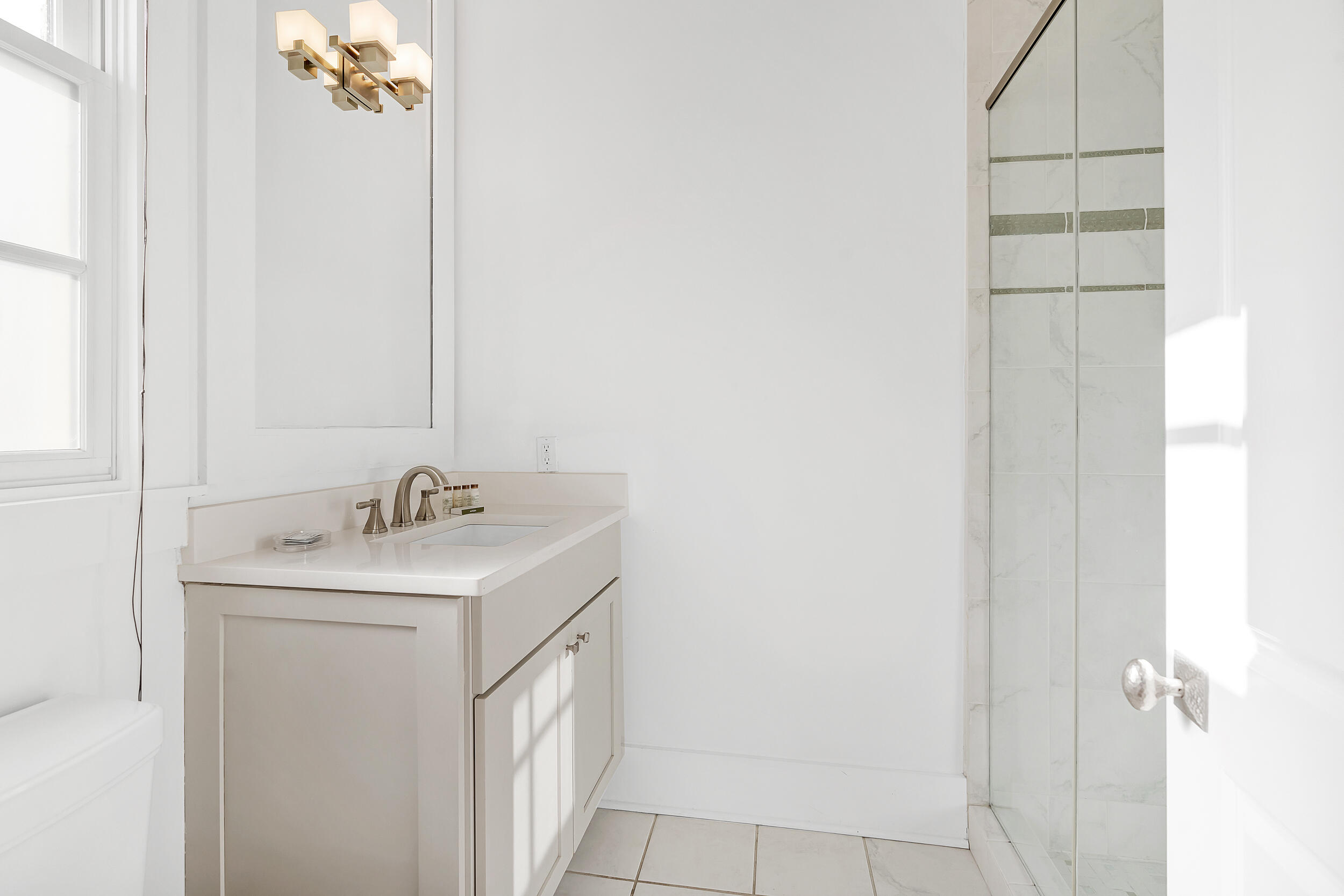 132 Kingston Road Rosemary Beach, FL 32461 - Photo 23 of 70 a bathroom with a sink and a mirror