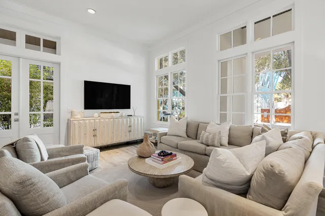 a view of a hallway with wooden floor and entryway