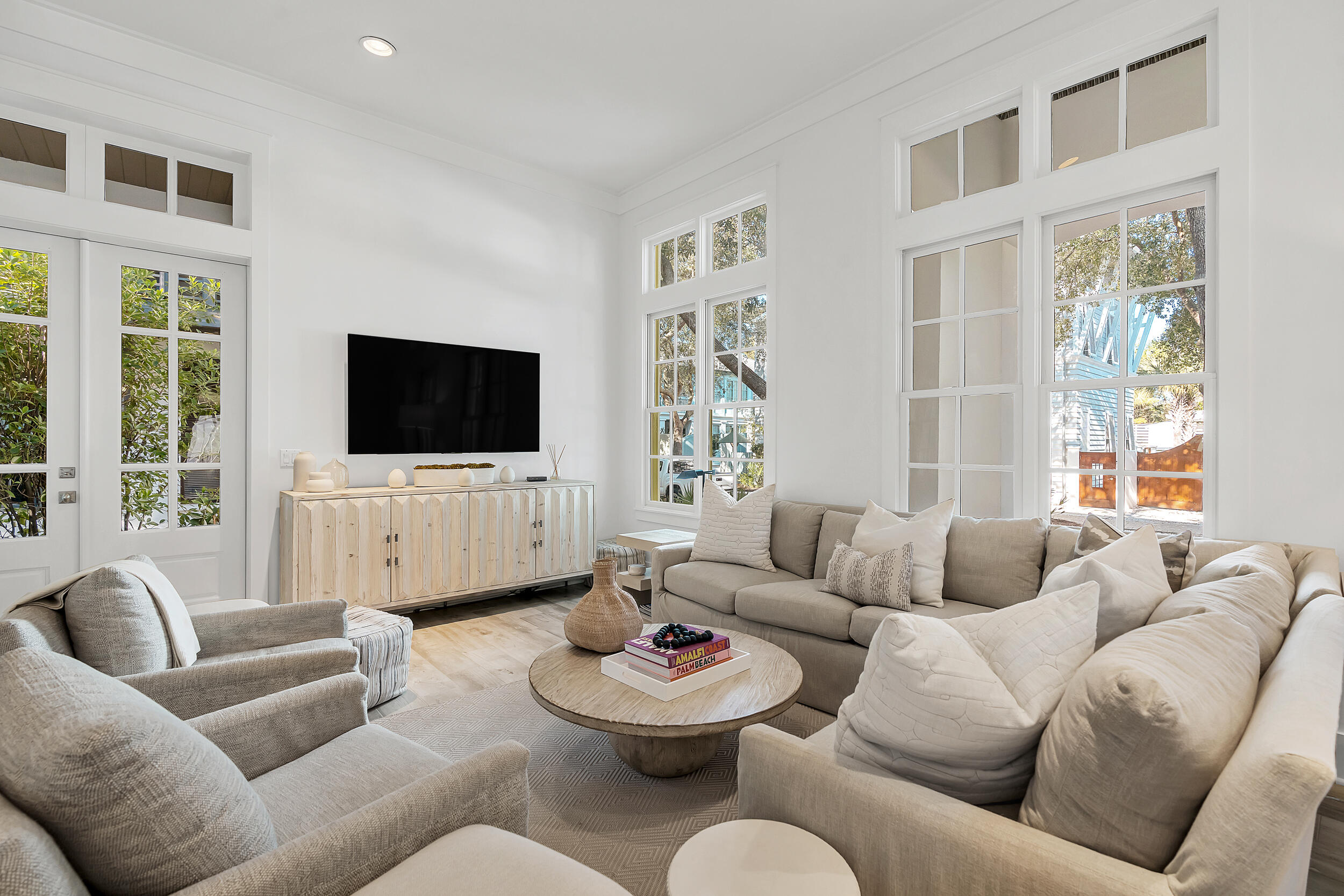 132 Kingston Road Rosemary Beach, FL 32461 - Photo 26 of 70 a living room with furniture a flat screen tv and a large window