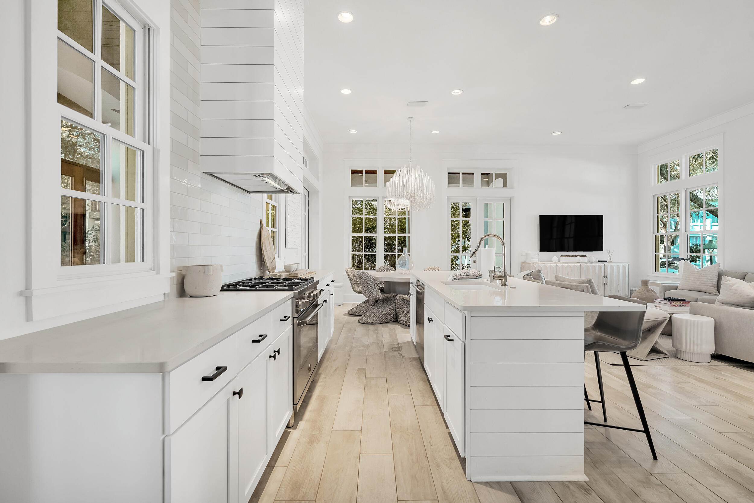 132 Kingston Road Rosemary Beach, FL 32461 - Photo 30 of 70 a large white kitchen with a large window and stainless steel appliances