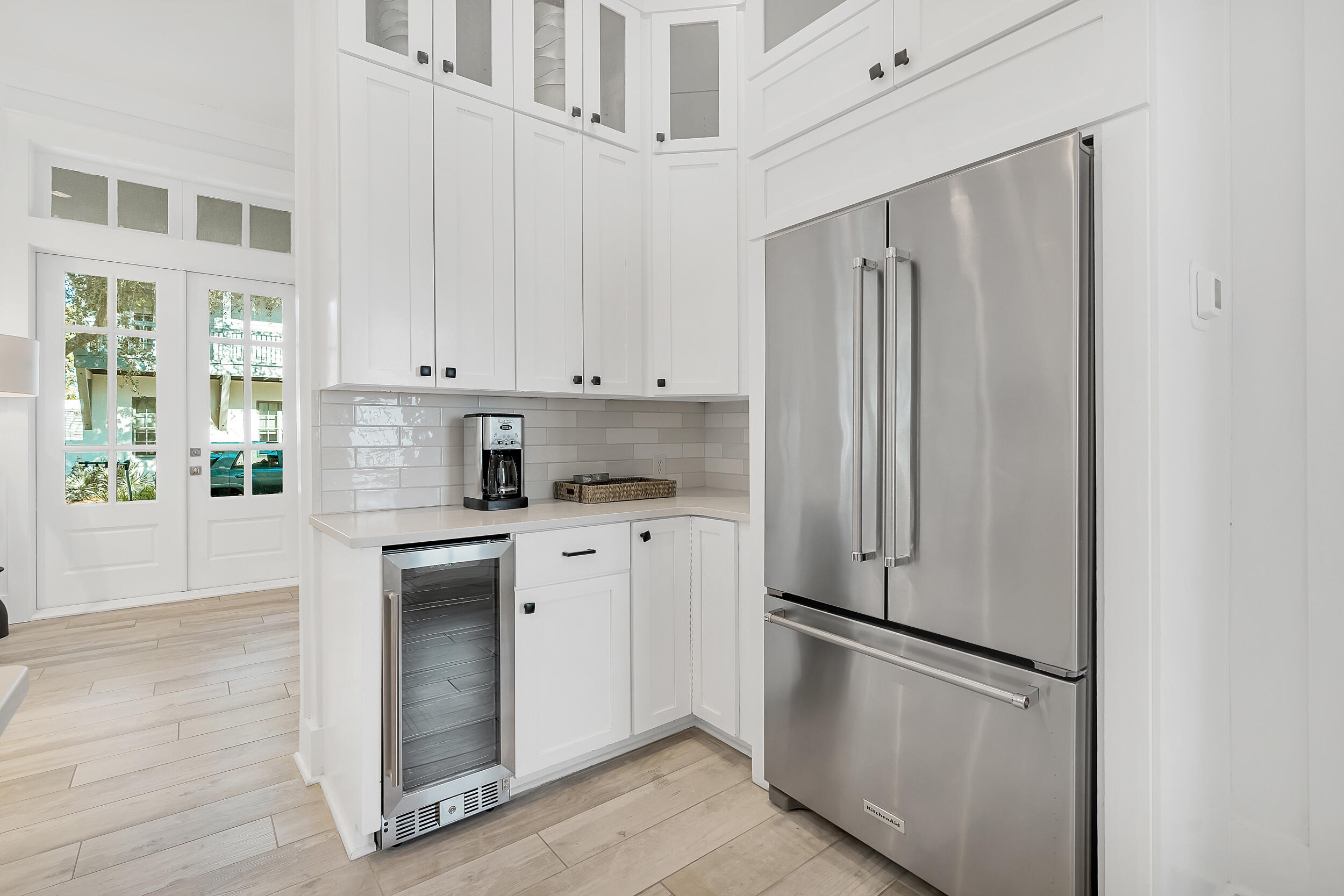 132 Kingston Road Rosemary Beach, FL 32461 - Photo 34 of 70 a kitchen with stainless steel appliances a refrigerator sink and cabinets