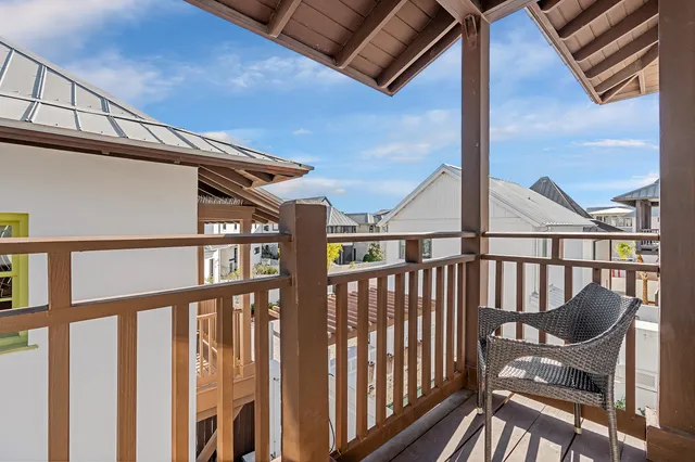 a view of a balcony with furniture