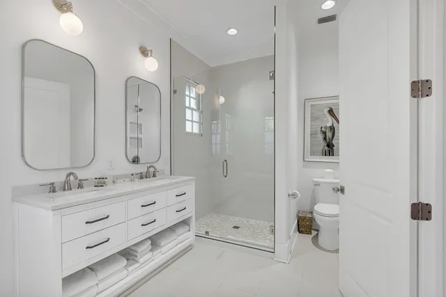 a view of street with small shops and fruits market