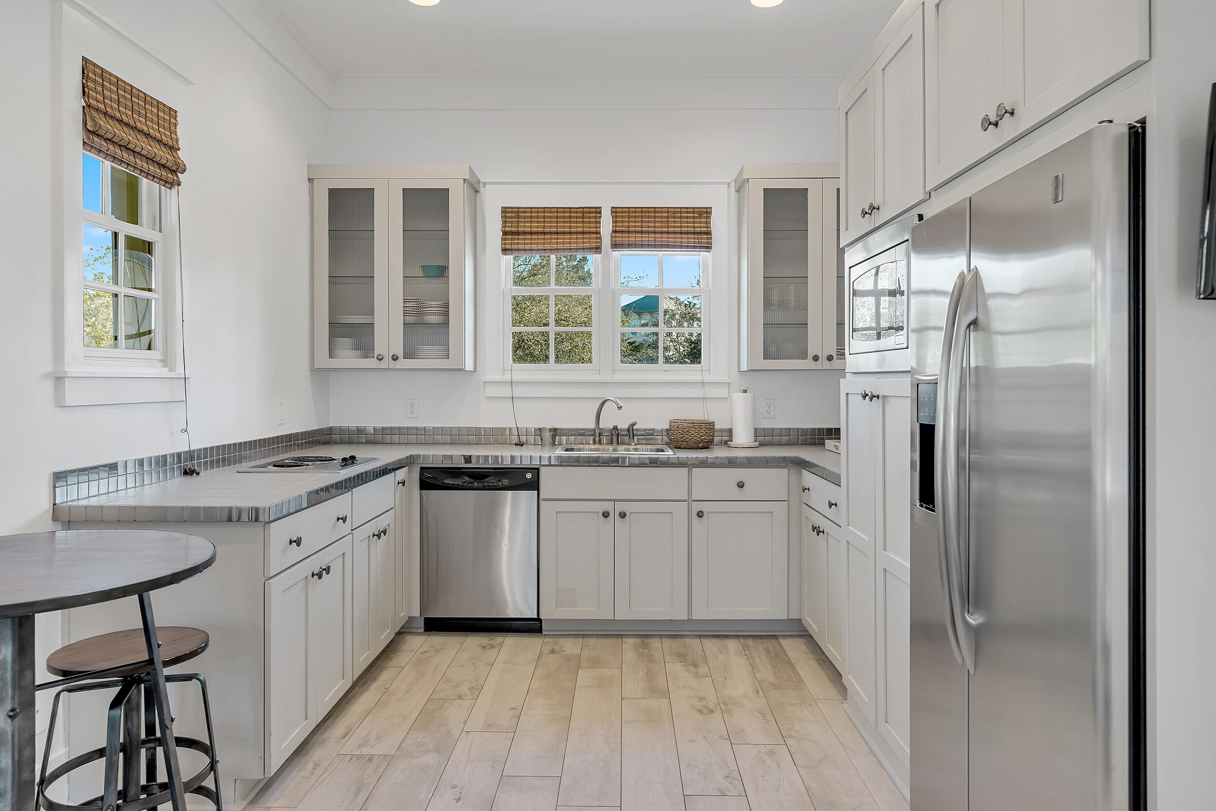 132 Kingston Road Rosemary Beach, FL 32461 - Photo 54 of 70 a kitchen with granite countertop a sink stainless steel appliances and window