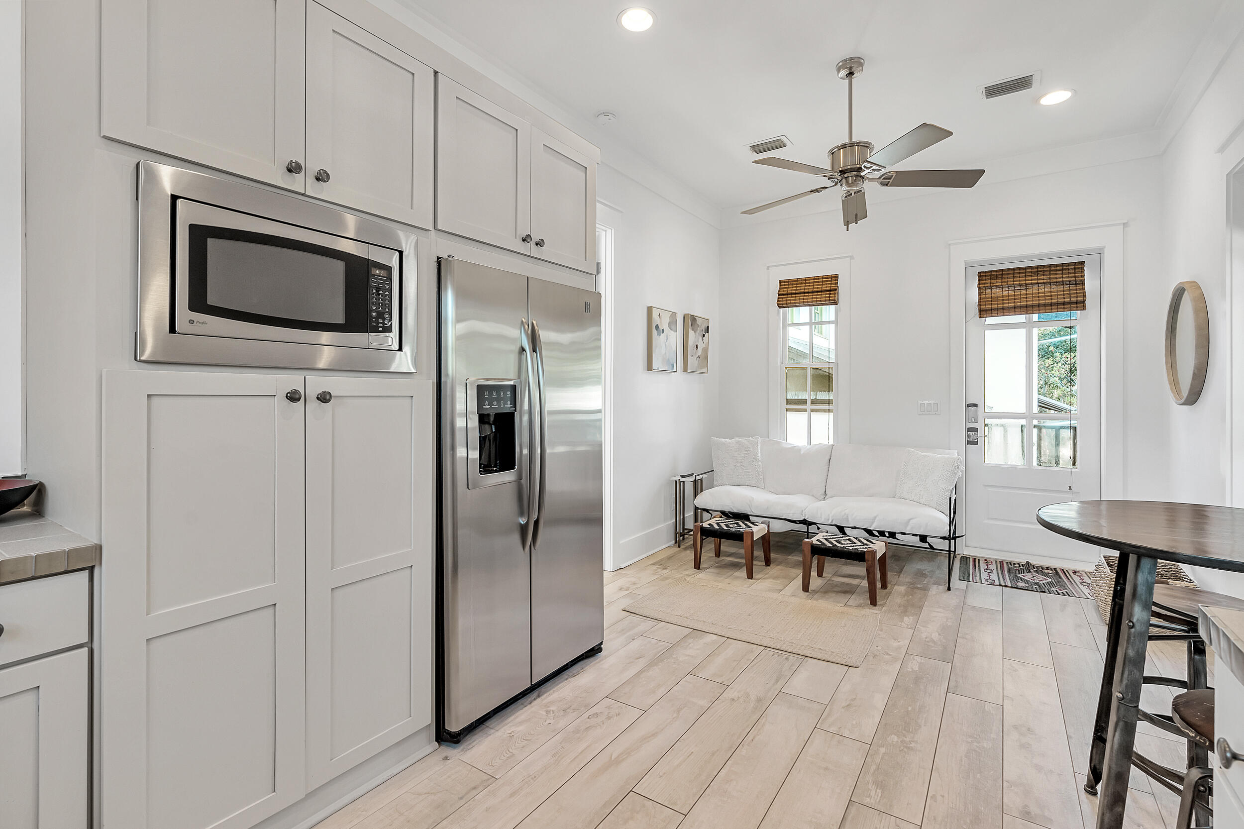 132 Kingston Road Rosemary Beach, FL 32461 - Photo 57 of 70 a living room with stainless steel appliances furniture a fireplace and a window