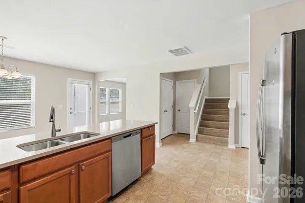 a room with lots of counter top space and two mirrors