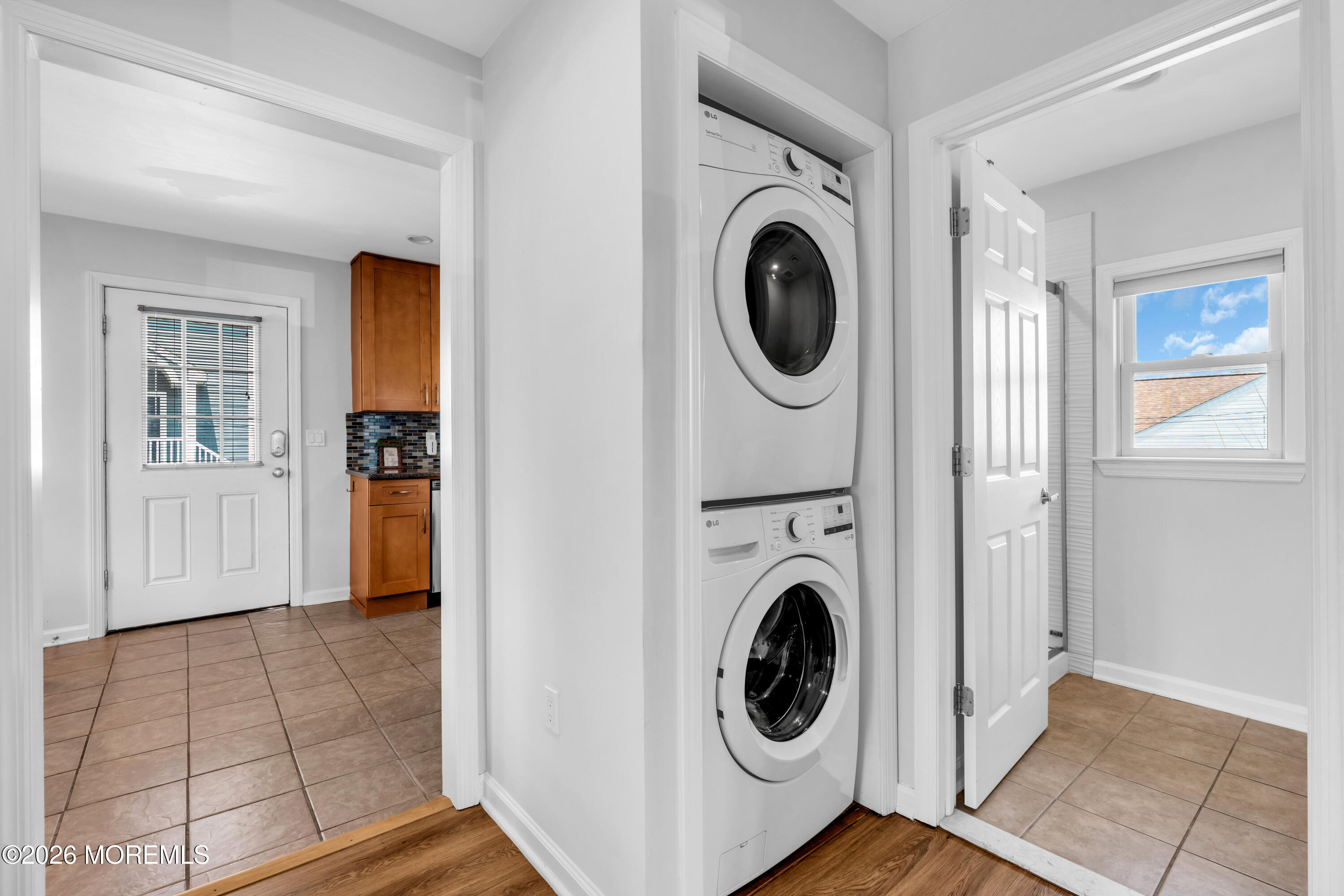 27 Arnold Avenue Point Pleasant Beach, NJ 08742 - Photo 16 of 48 a view of a hallway with washer and dryer