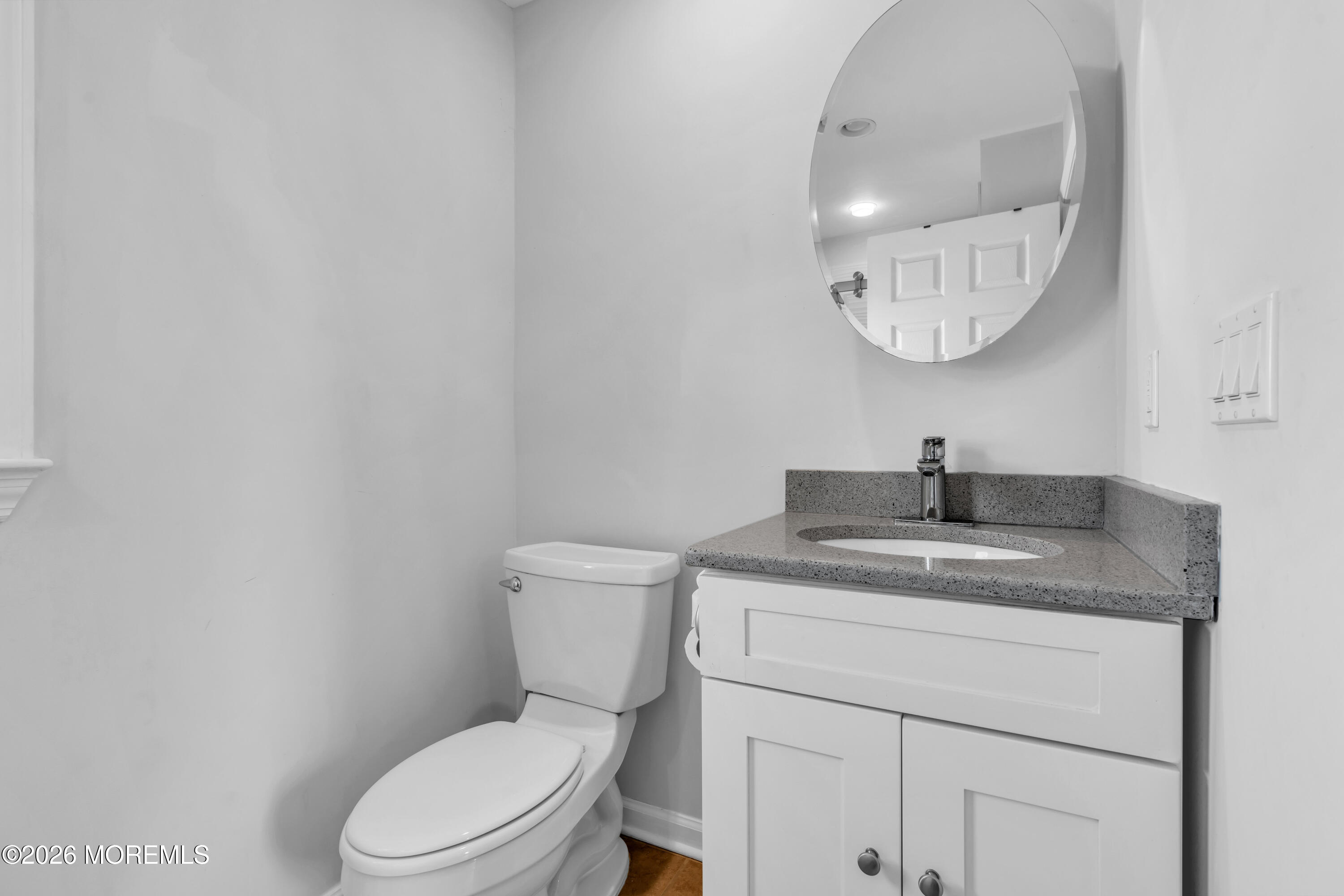 27 Arnold Avenue Point Pleasant Beach, NJ 08742 - Photo 17 of 48 a bathroom with a granite countertop toilet sink and mirror