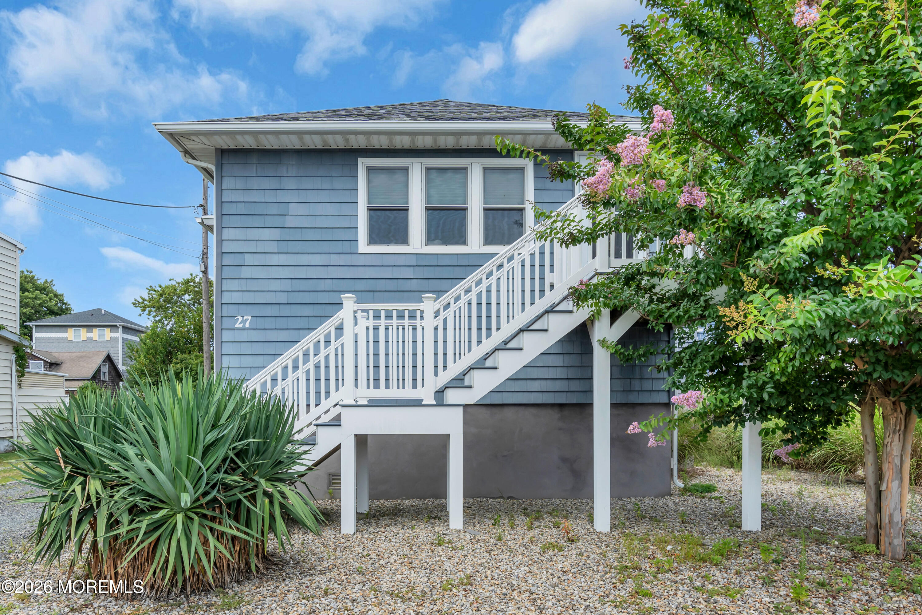 27 Arnold Avenue Point Pleasant Beach, NJ 08742 - Photo 2 of 48 a view of a house with plants and wooden fence