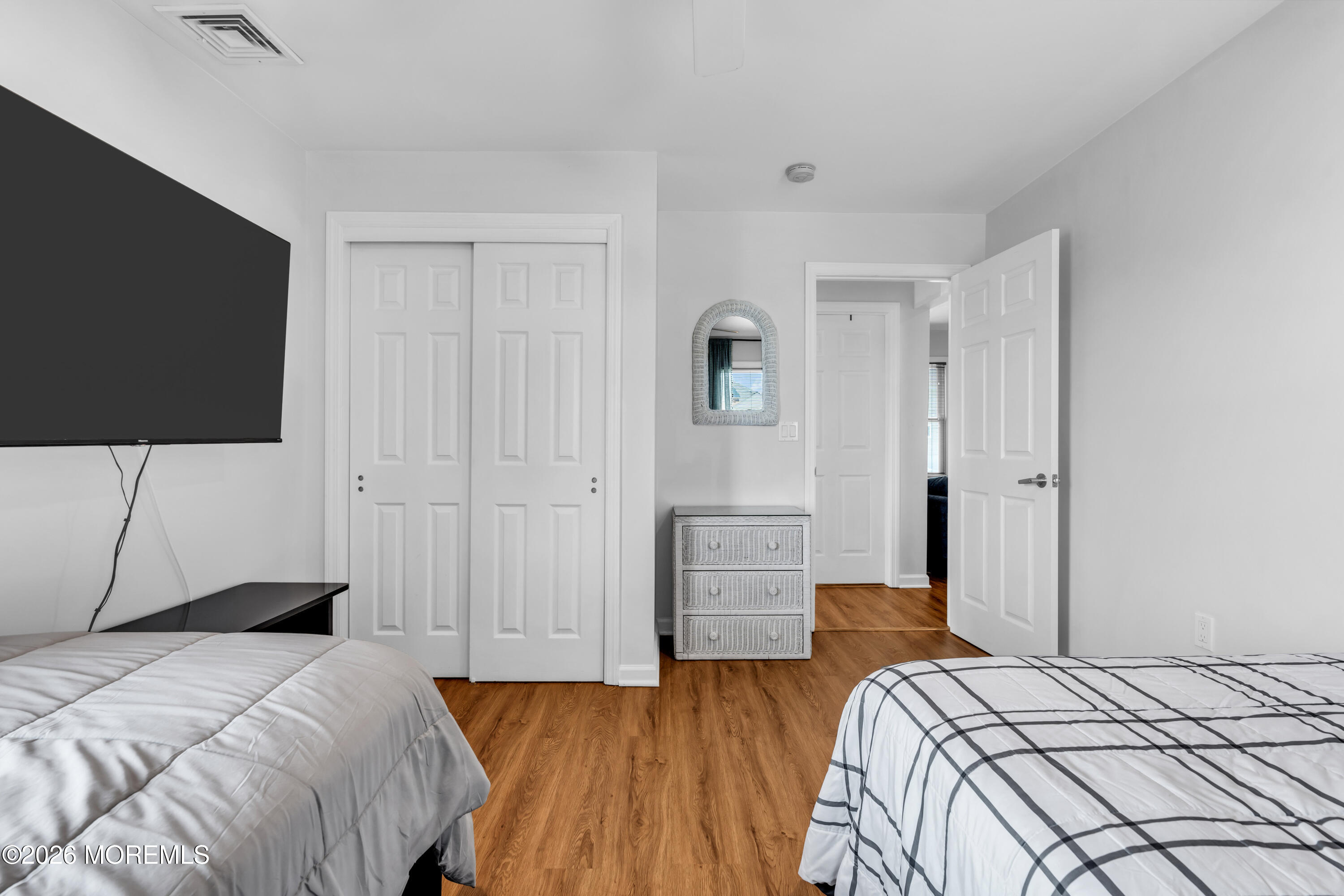 27 Arnold Avenue Point Pleasant Beach, NJ 08742 - Photo 28 of 48 a bedroom with a bed and a flat screen tv