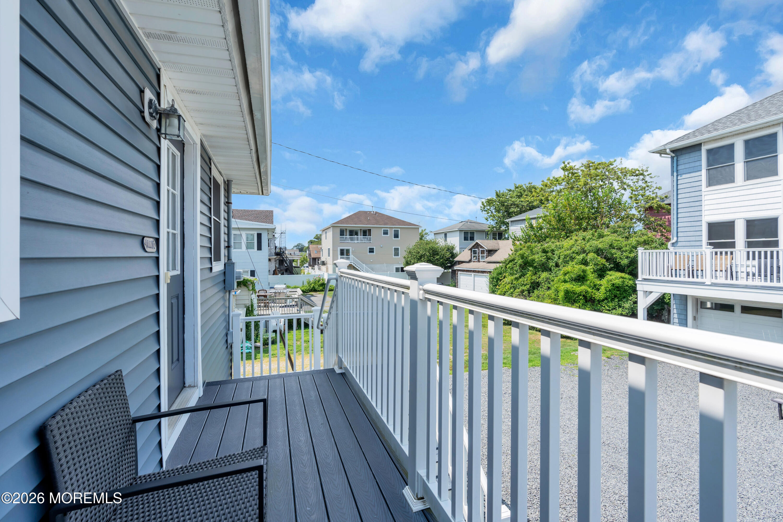 27 Arnold Avenue Point Pleasant Beach, NJ 08742 - Photo 32 of 48 a view of a balcony with wooden fence and floor