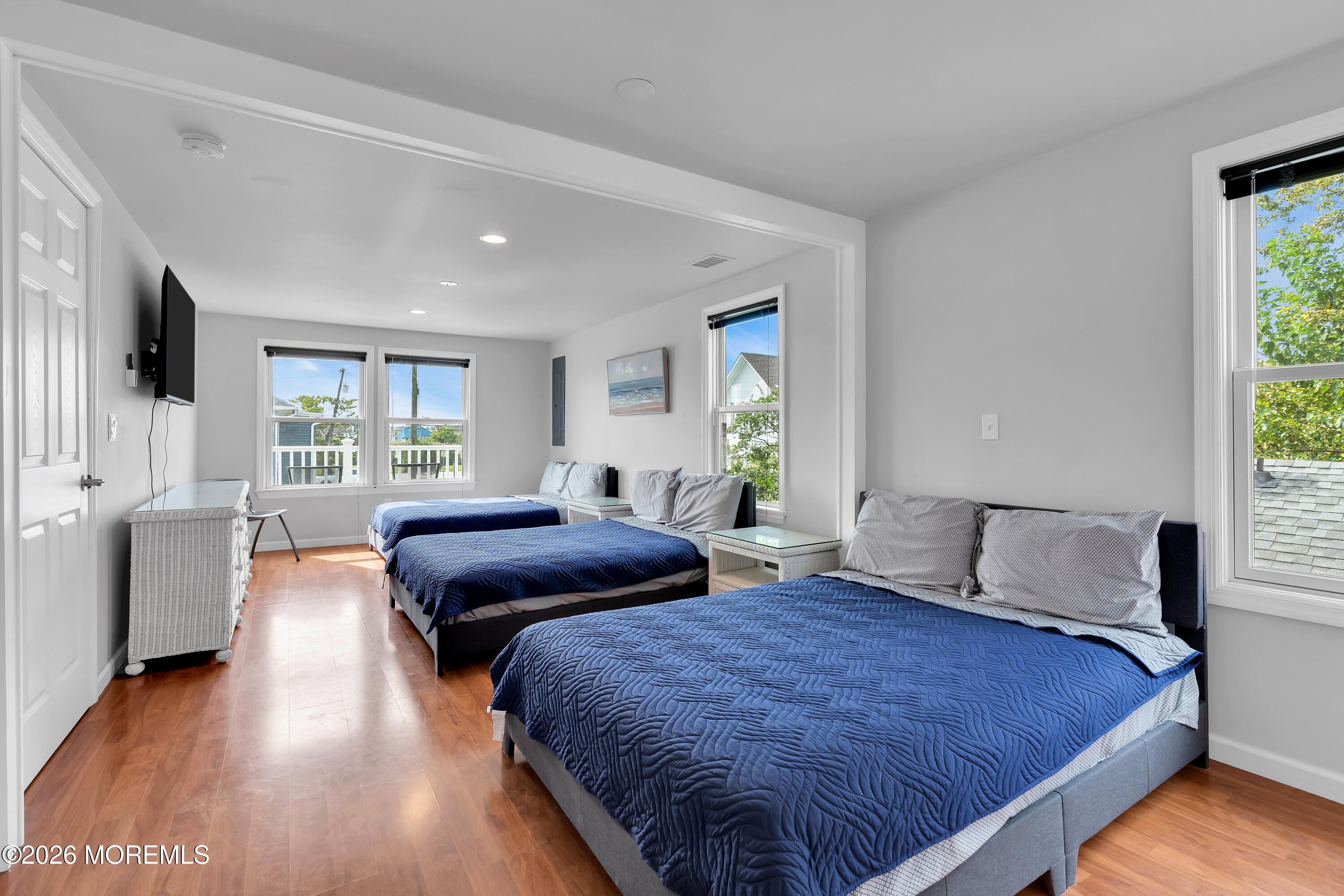 27 Arnold Avenue Point Pleasant Beach, NJ 08742 - Photo 36 of 48 a bedroom with a bed and a large window