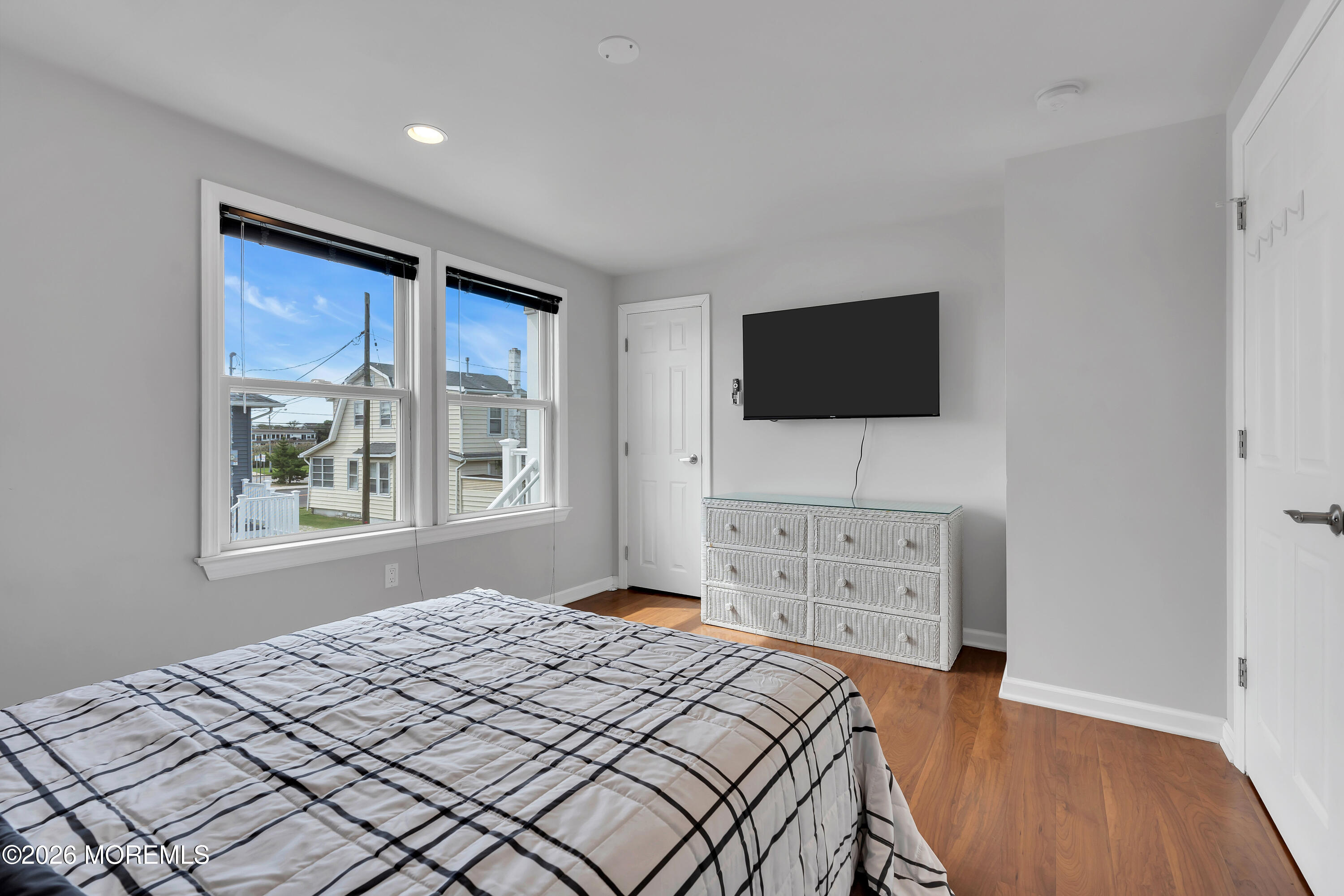 27 Arnold Avenue Point Pleasant Beach, NJ 08742 - Photo 37 of 48 a bedroom with a bed and a flat screen tv