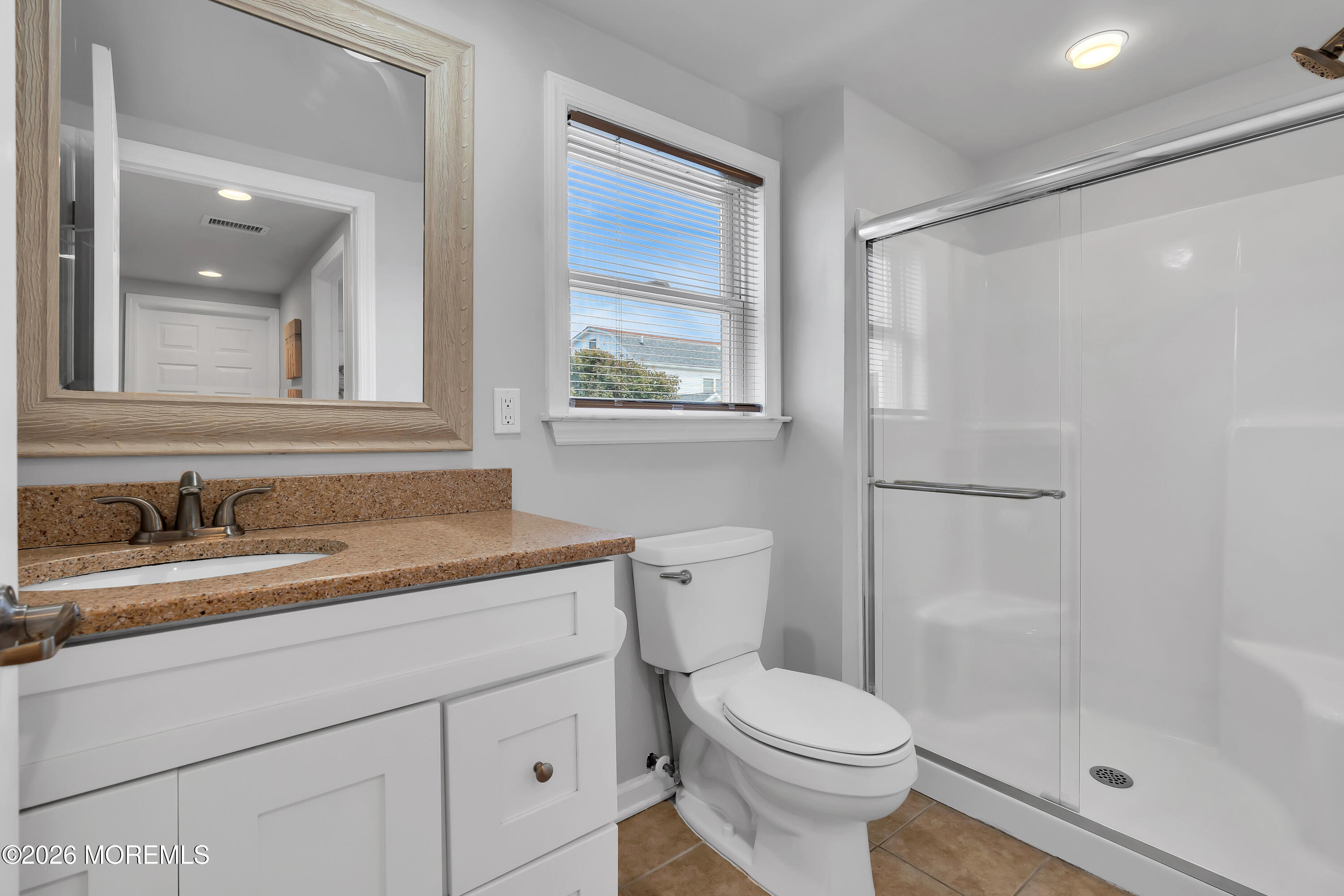 27 Arnold Avenue Point Pleasant Beach, NJ 08742 - Photo 39 of 48 a bathroom with a granite countertop sink toilet and shower