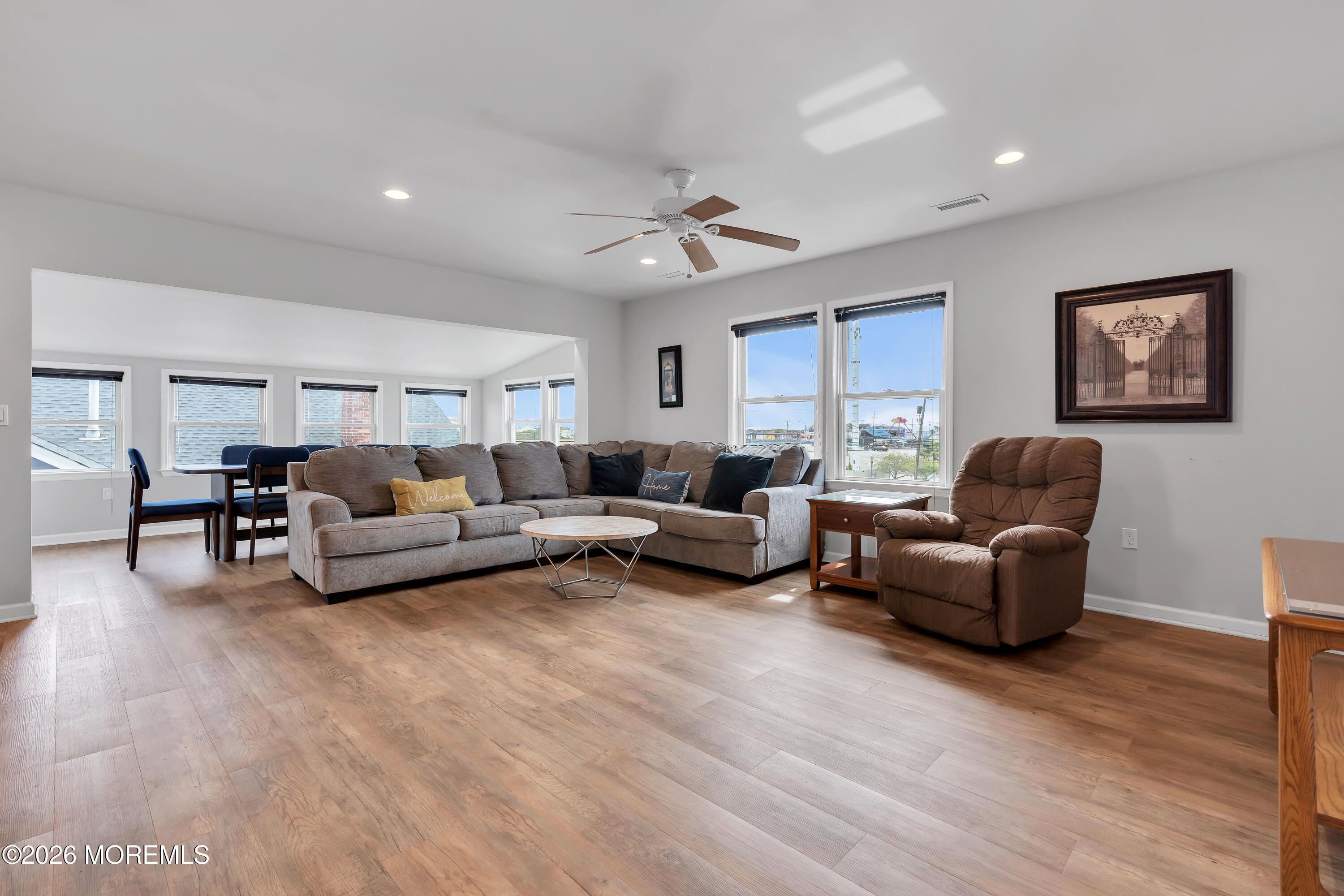 27 Arnold Avenue Point Pleasant Beach, NJ 08742 - Photo 40 of 48 a living room with furniture and wooden floor