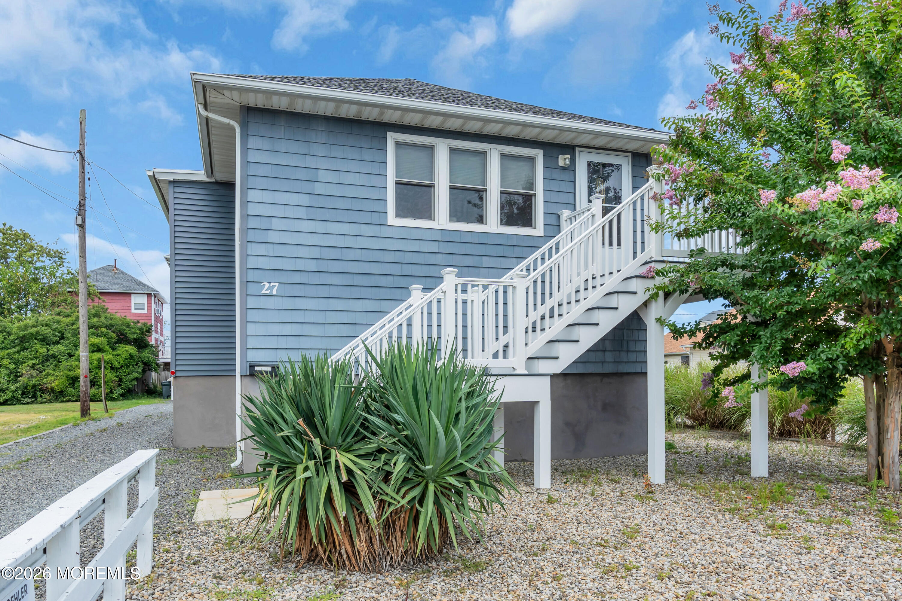 27 Arnold Avenue Point Pleasant Beach, NJ 08742 - Photo 5 of 48 a view of a house with brick walls and potted plants