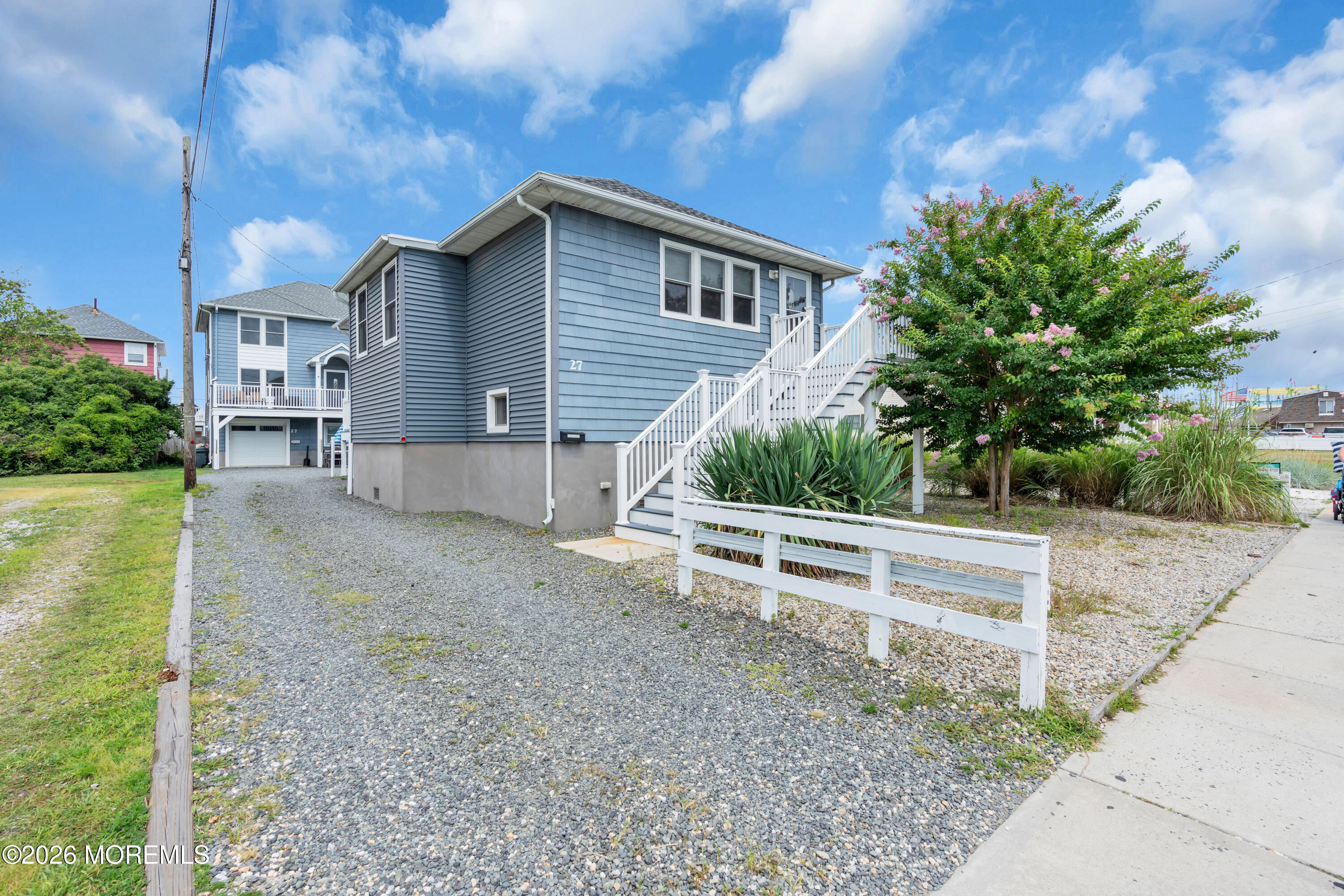 27 Arnold Avenue Point Pleasant Beach, NJ 08742 - Photo 6 of 48 a view of a house with a yard