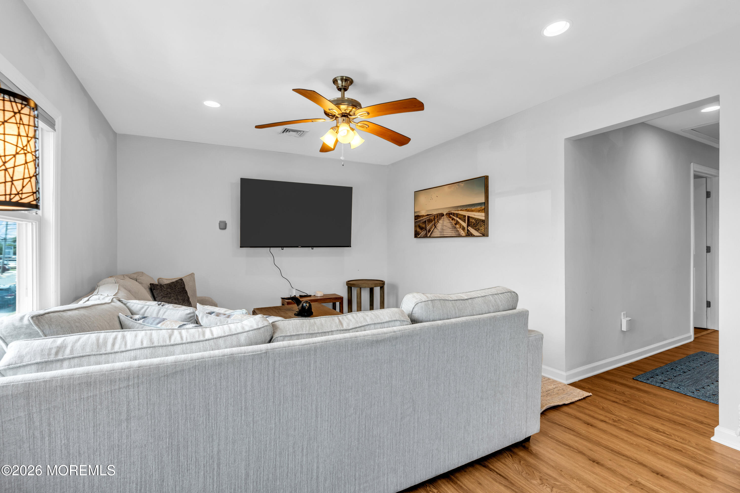 27 Arnold Avenue Point Pleasant Beach, NJ 08742 - Photo 9 of 48 a living room with furniture and a flat screen tv