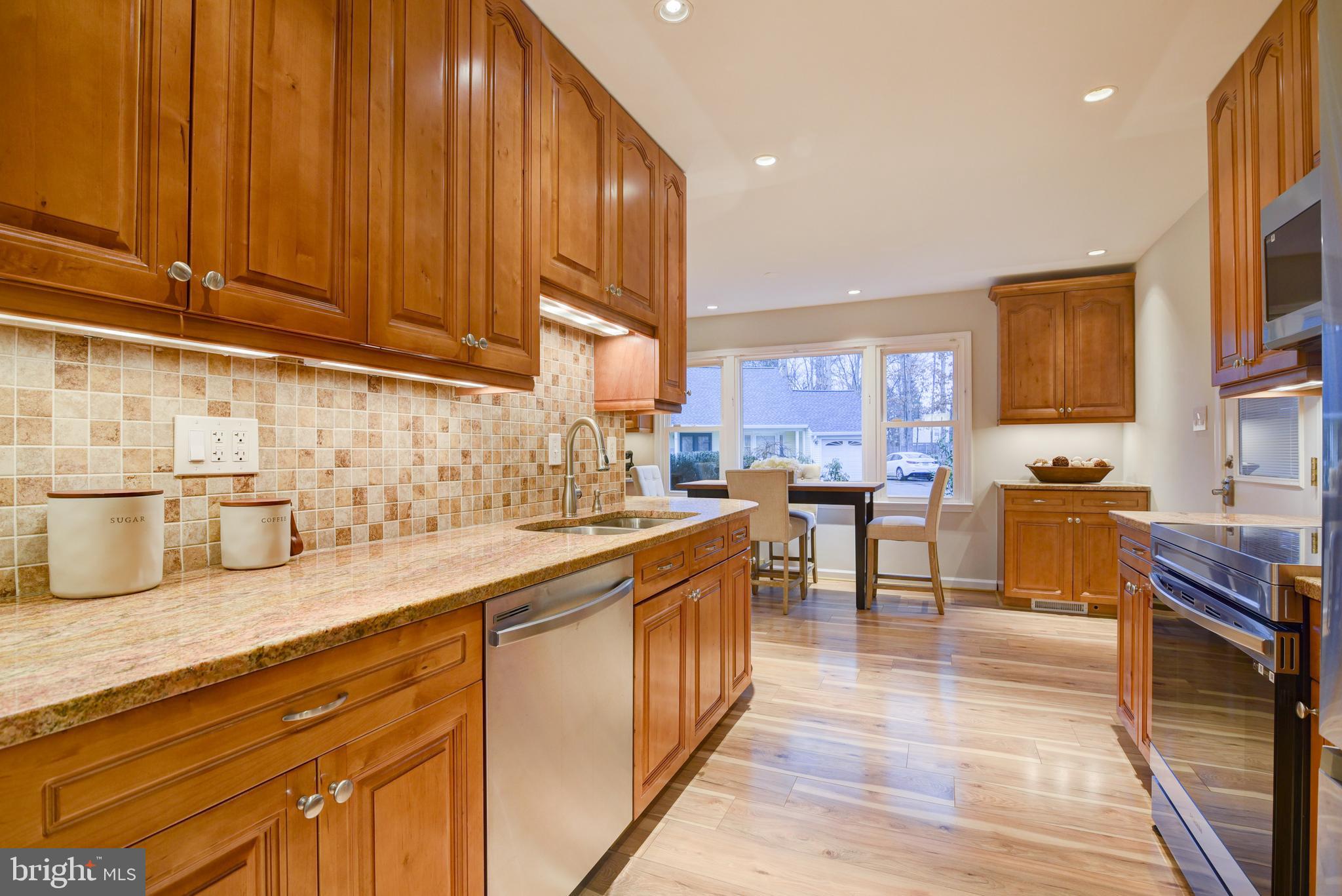 1520 Coat Ridge Road Herndon, VA 20170 - Photo 12 of 33 Granite Counters and Under Cabinet Lighting.