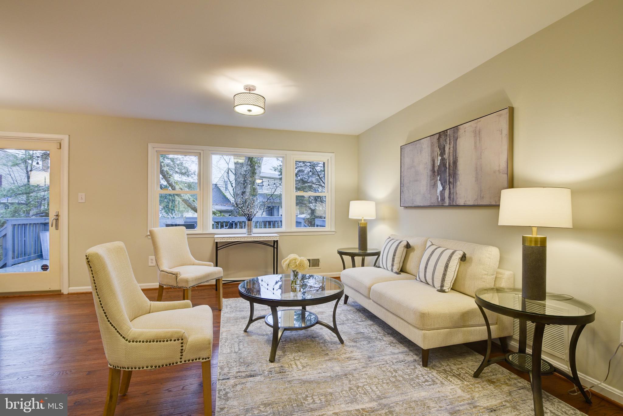 Living Room with  Windows Overlooking Back Yard.