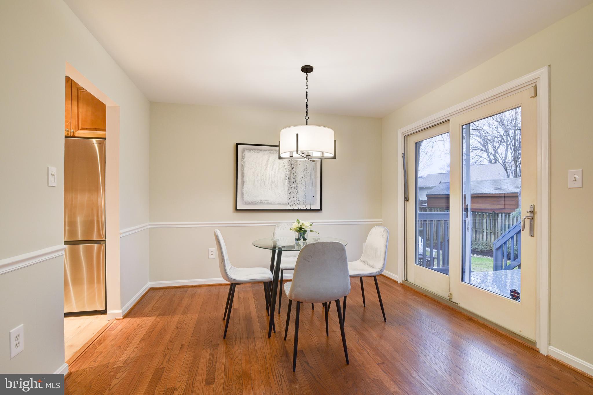 Dining Room with Glass Door to Expansive Deck.