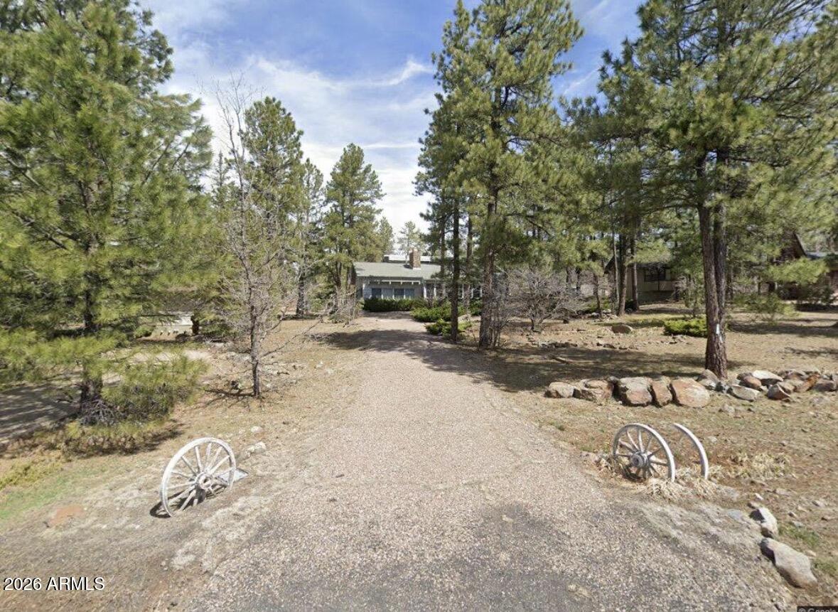 700 East Crestline Road Munds Park, AZ 86017 - Photo 1 of 61 a view of street with trees