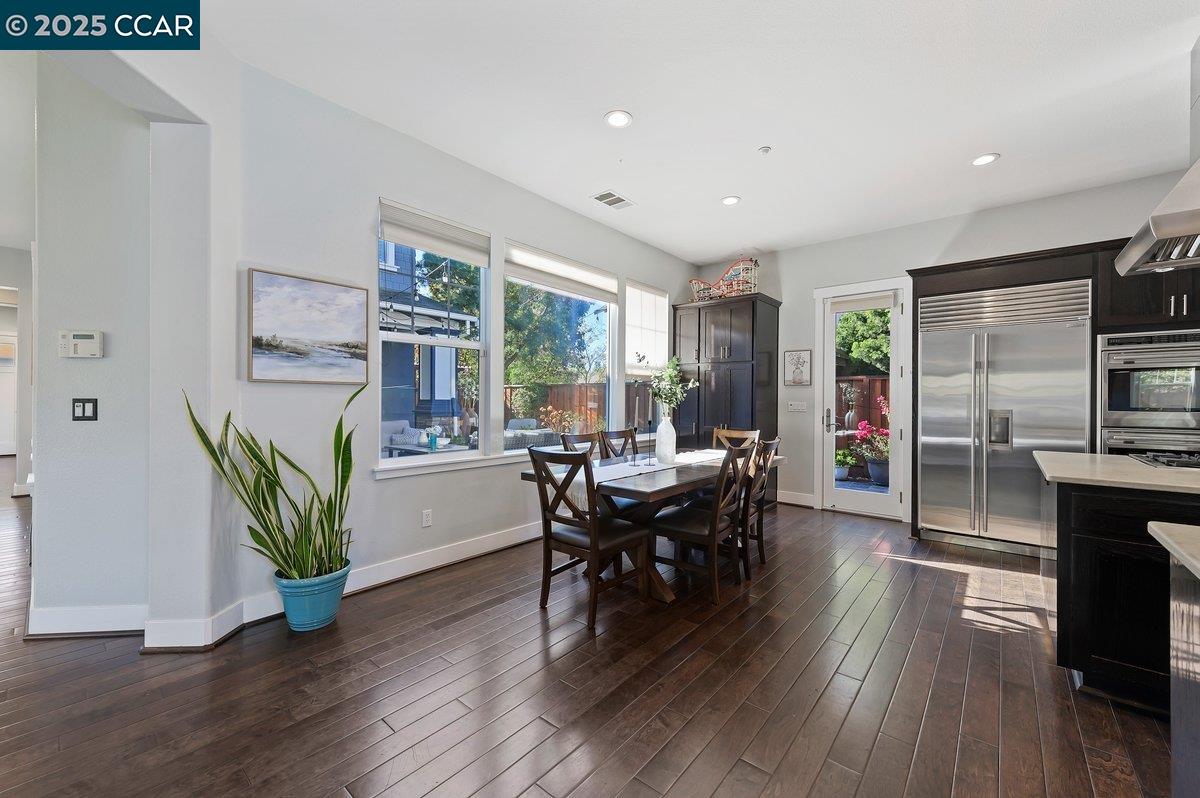 5656 Stockton Loop Livermore, CA 94550 - Photo 14 of 37 a living room with furniture a wooden floor and a fireplace